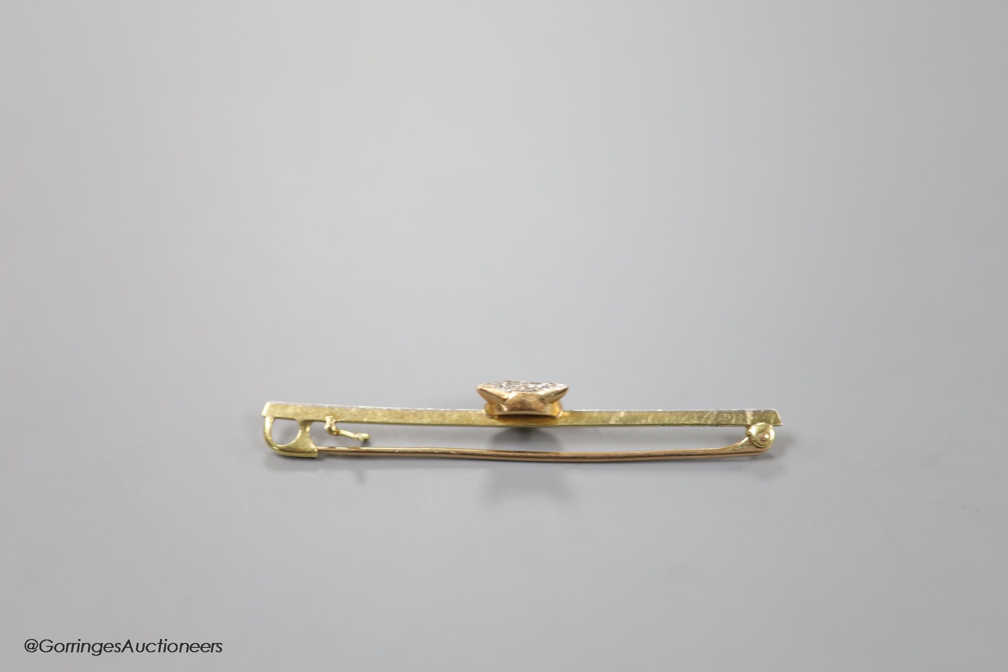 A late Victorian 15ct, pt and rose cut diamond set fox head bar brooch, 56mm, gross weight 3.4 grams.